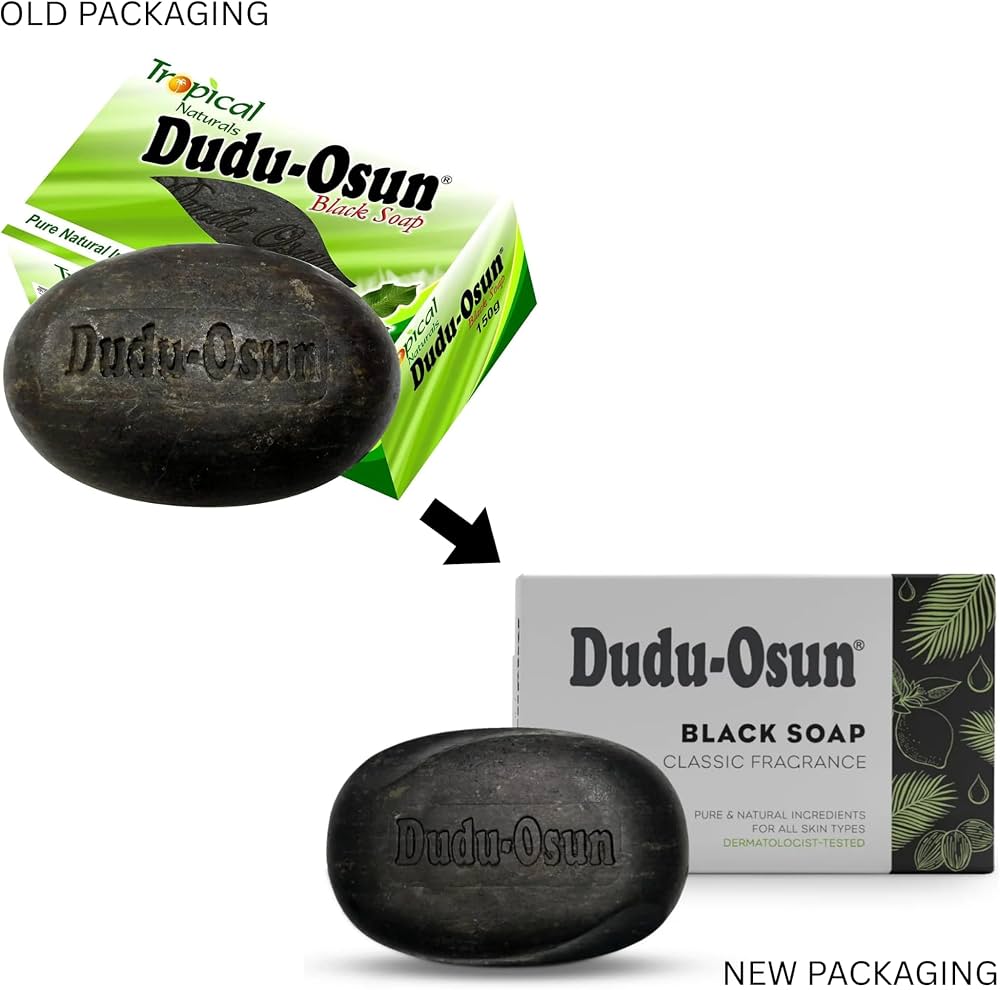 Dudu-Osun black soap packaging, showing the old green tropical-themed packaging at the top and the new gray and green packaging at the bottom, with a black soap bar in front of each package.