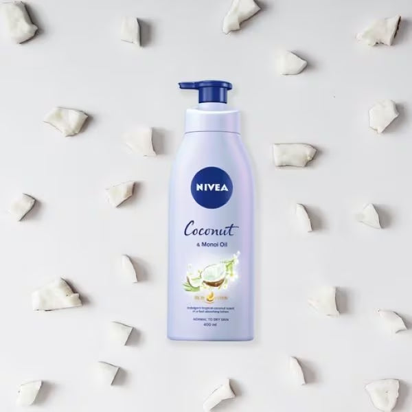 Nivea Coconut lotion bottle surrounded by coconut pieces