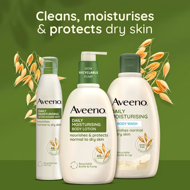 Three Aveeno body care products on a green background with oat graphics and the text 'Cleans, moisturises & protects dry skin.' The products are a shower mist bottle, a body lotion bottle with a pump, and a body wash bottle.