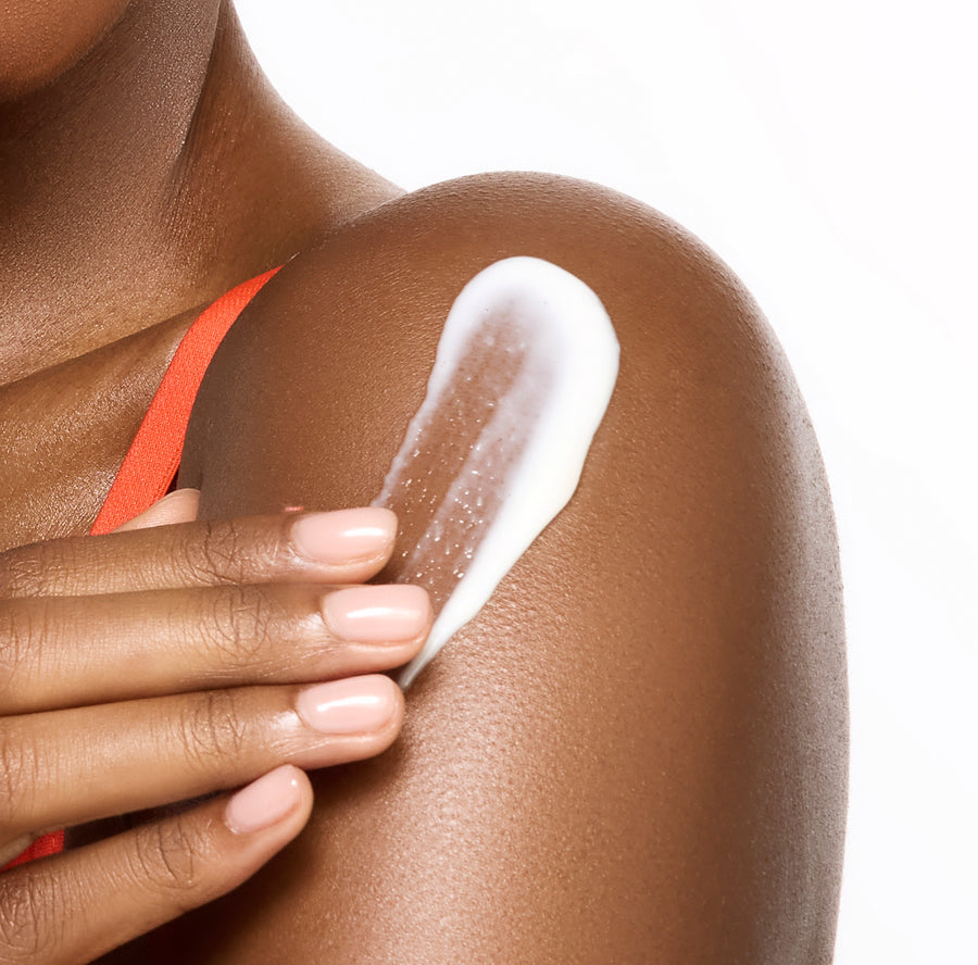 Applying Million Dollar Glow body lotion