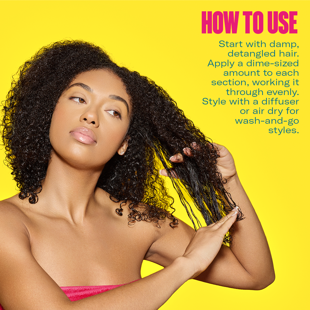Model applying Mielle Curl Forming Glaze to damp detangled curls
