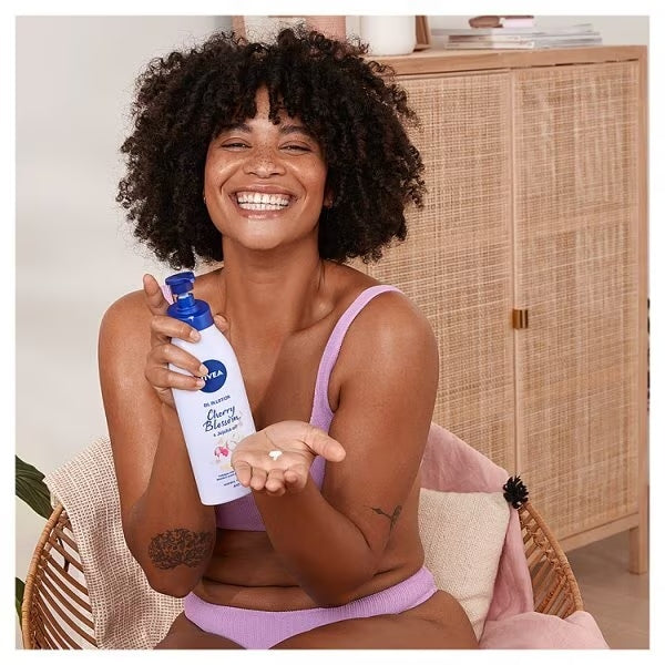 Nivea Woman applying Cherry Blossom lotion