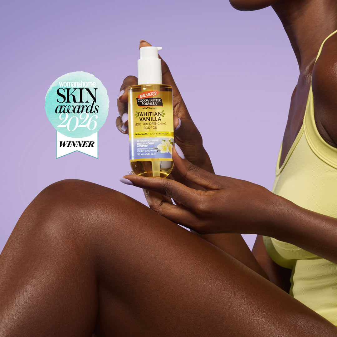 Hand holding the Tahitian Vanilla body oil bottle against a bare leg, with a Skin Awards 2026 winner badge